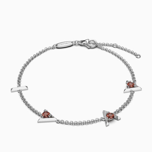 Silver bracelet with Silver Bracelet with "I am greater than my highs and lows" charms and  red gemstones on a white background