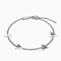 Silver bracelet with "I am greater than my highs and lows" charms and peridot (green gemstones) on a white background