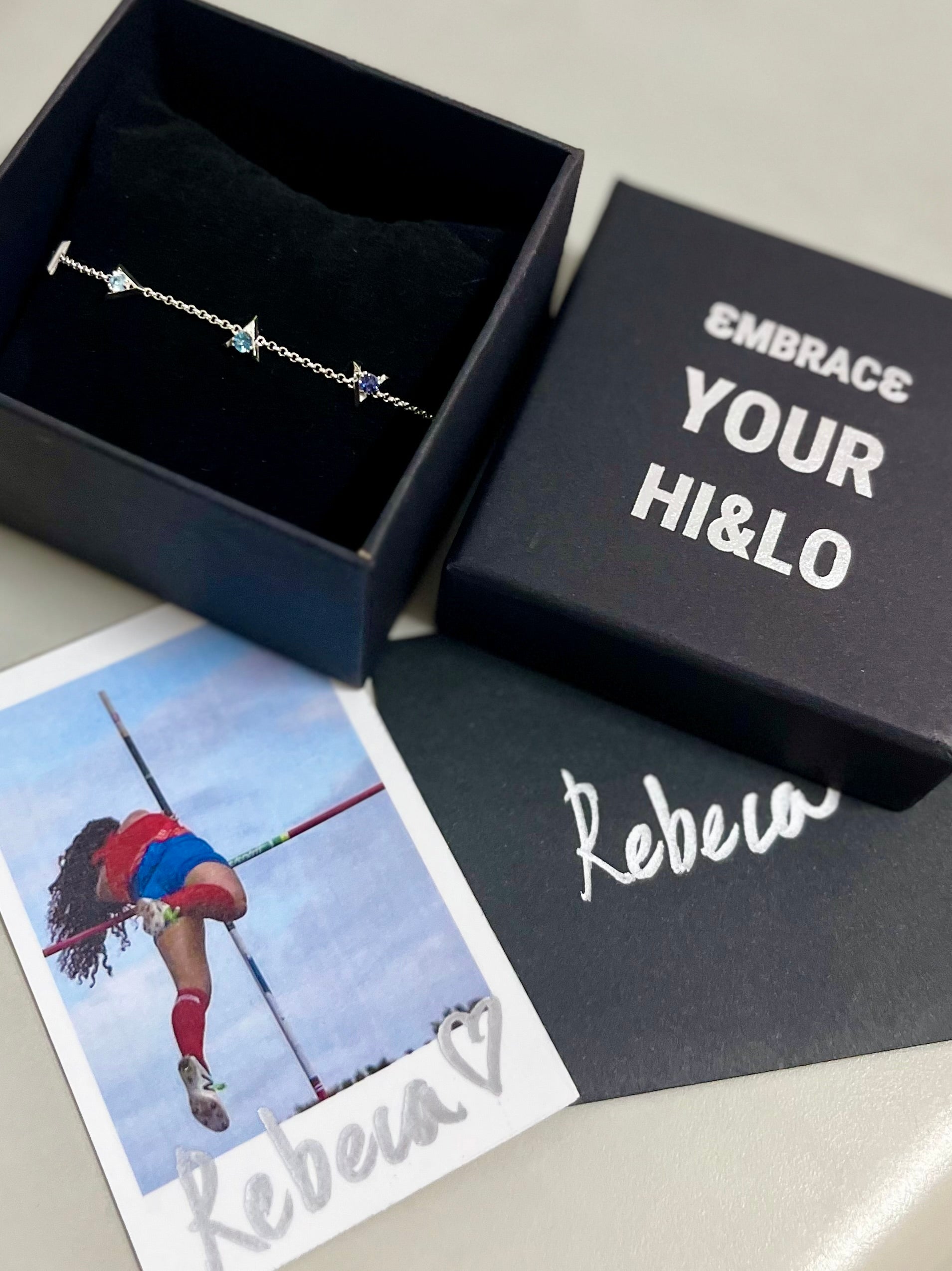 hi and lo signature Bracelet in a box with 'Embrace Your Hi&Lo' text and a photo.