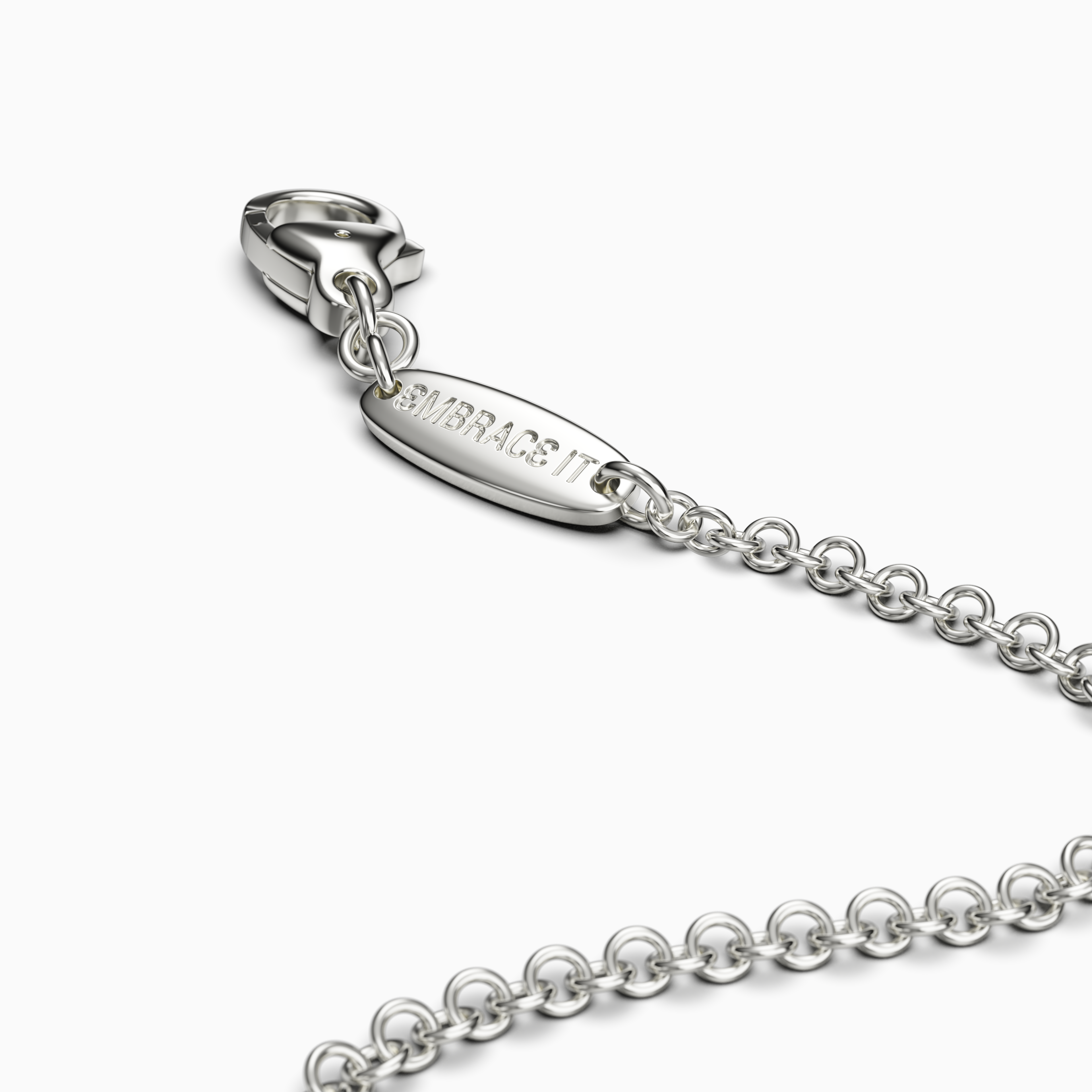 "EMBRACE IT" silver chain tag with a lobster clasp on a white background