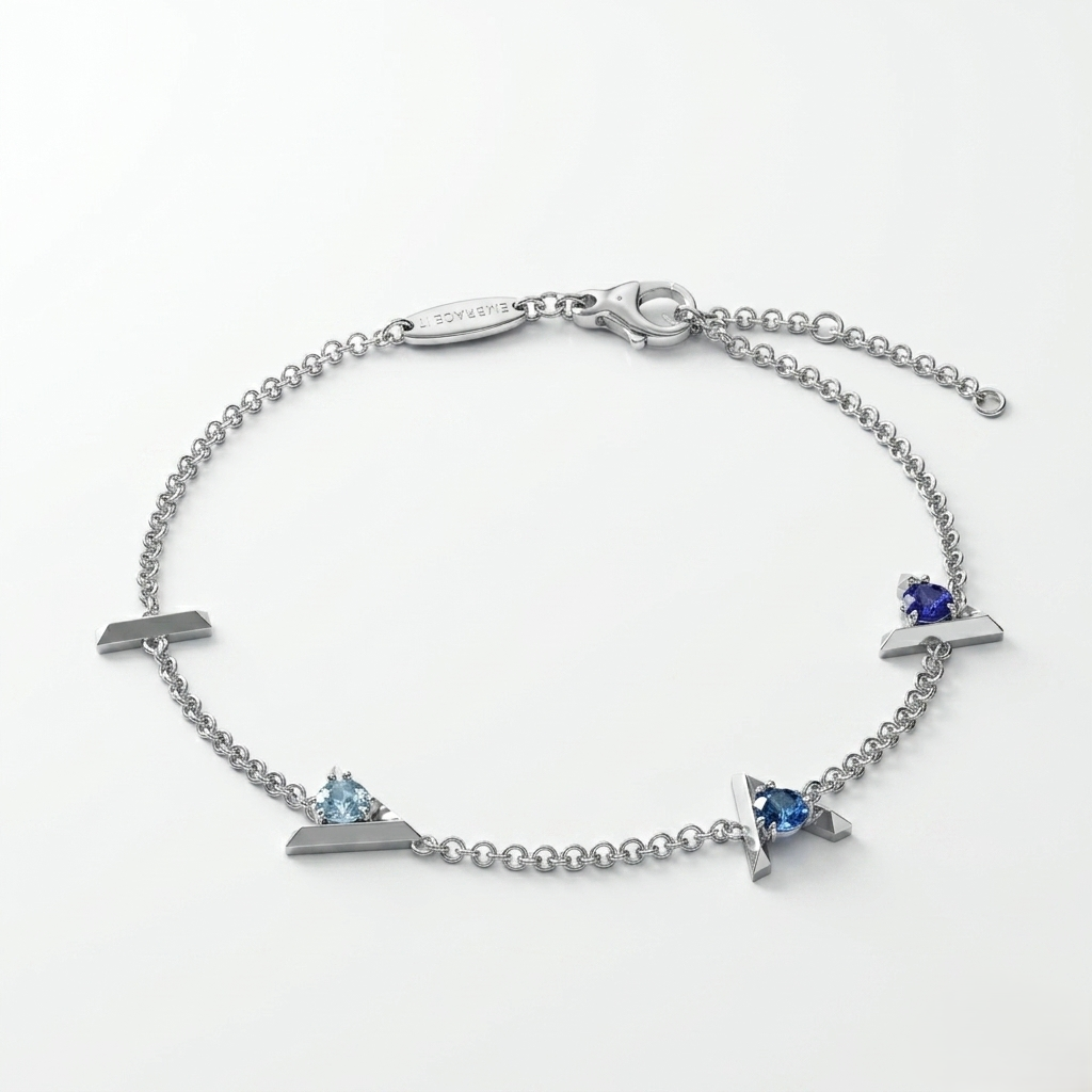 Silver bracelet with blue gemstones on a white background